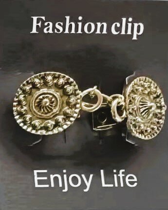 Clips,  Zeeuwse knoop met midden een ring in kleur antiek goud look.