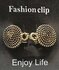 Clips, met symbool cirkel en midden een ring in kleur antiek goud look. _